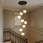 Tall Glass and Metal LED Staircase Chandelier in Black